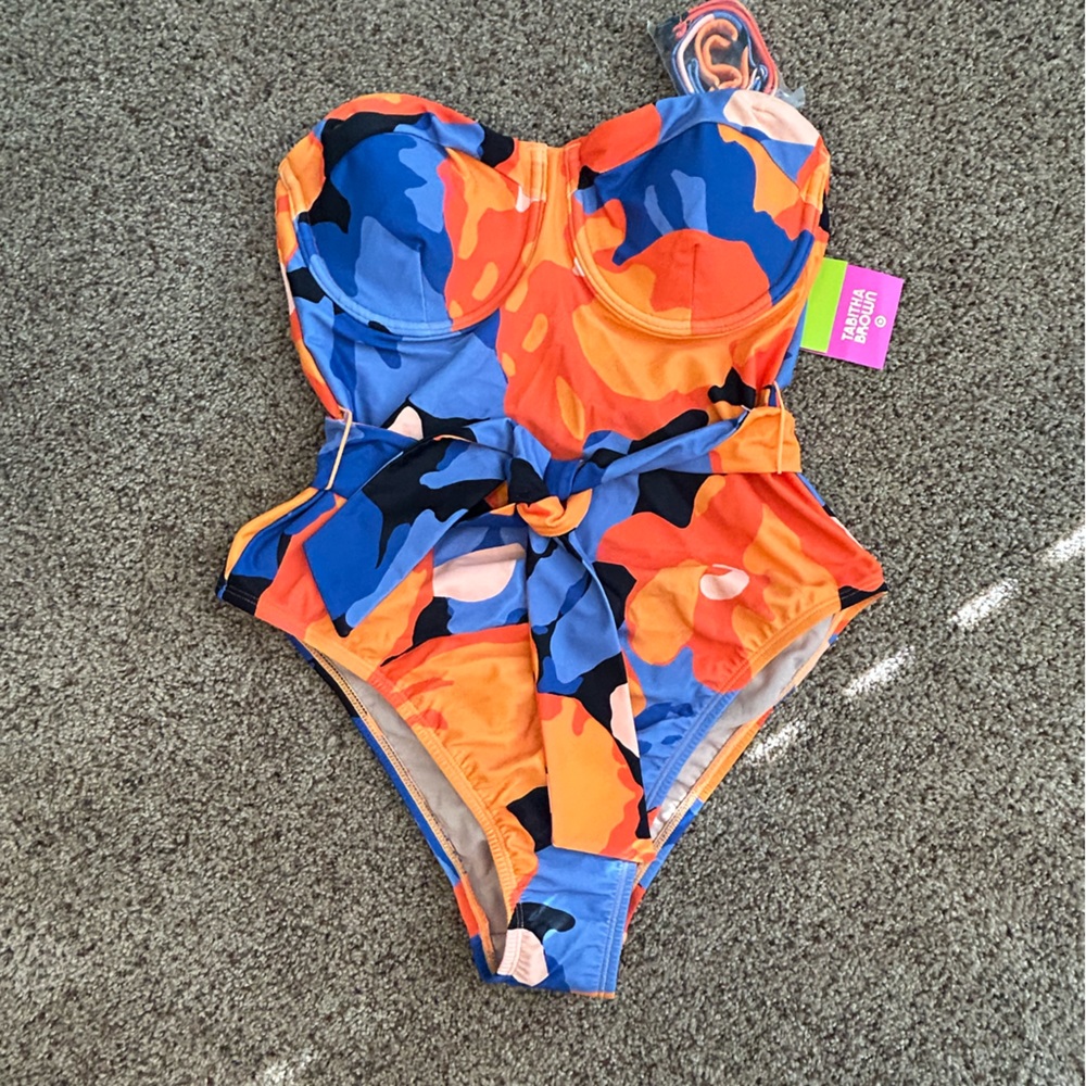 New one piece medium swimsuit with tags. Tabatha brown